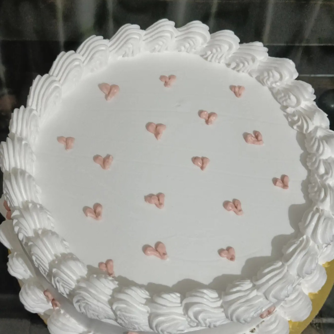 Kulfi faluda flavour cake with tiny pink hearts